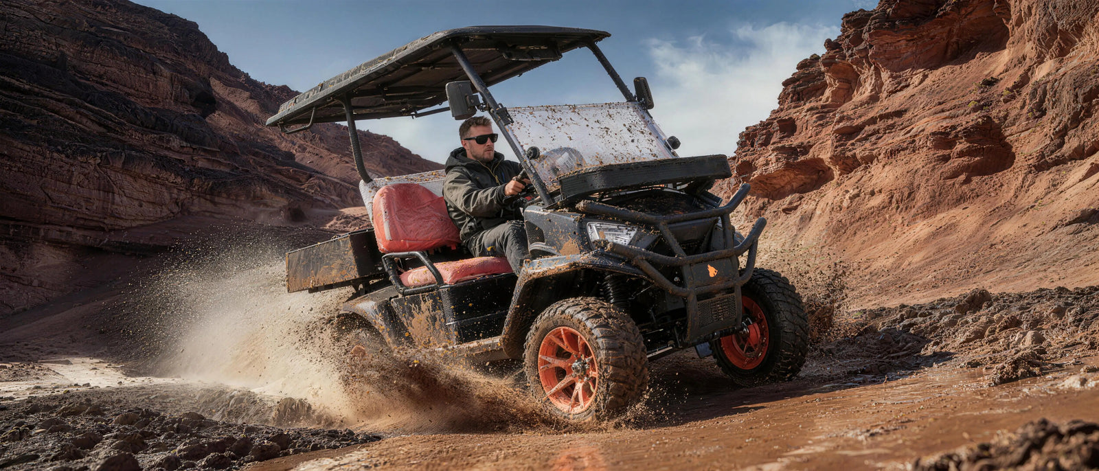 Wolverine cart driving on open terrain